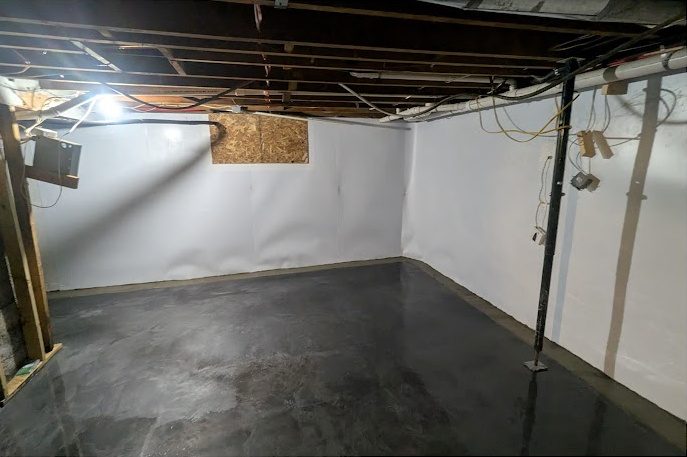 After: the same corner with white liner and a finished dark floor