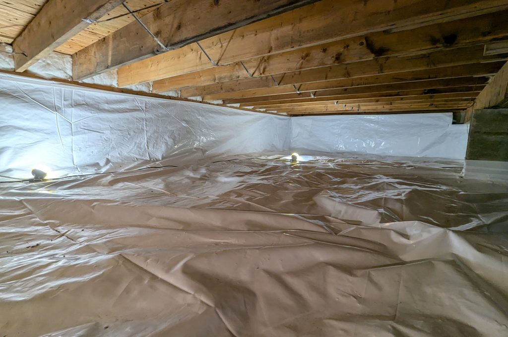 After: the same crawl space fully lined in white