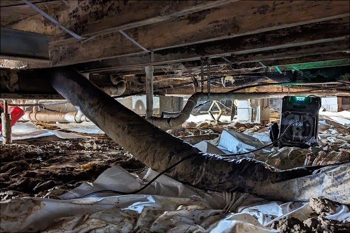 Before: a crawl space in its original condition
