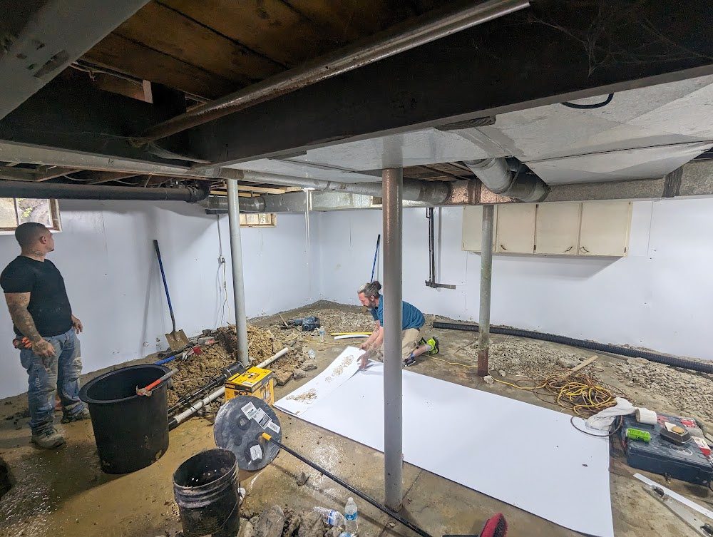 Crew and materials during basement wall installation