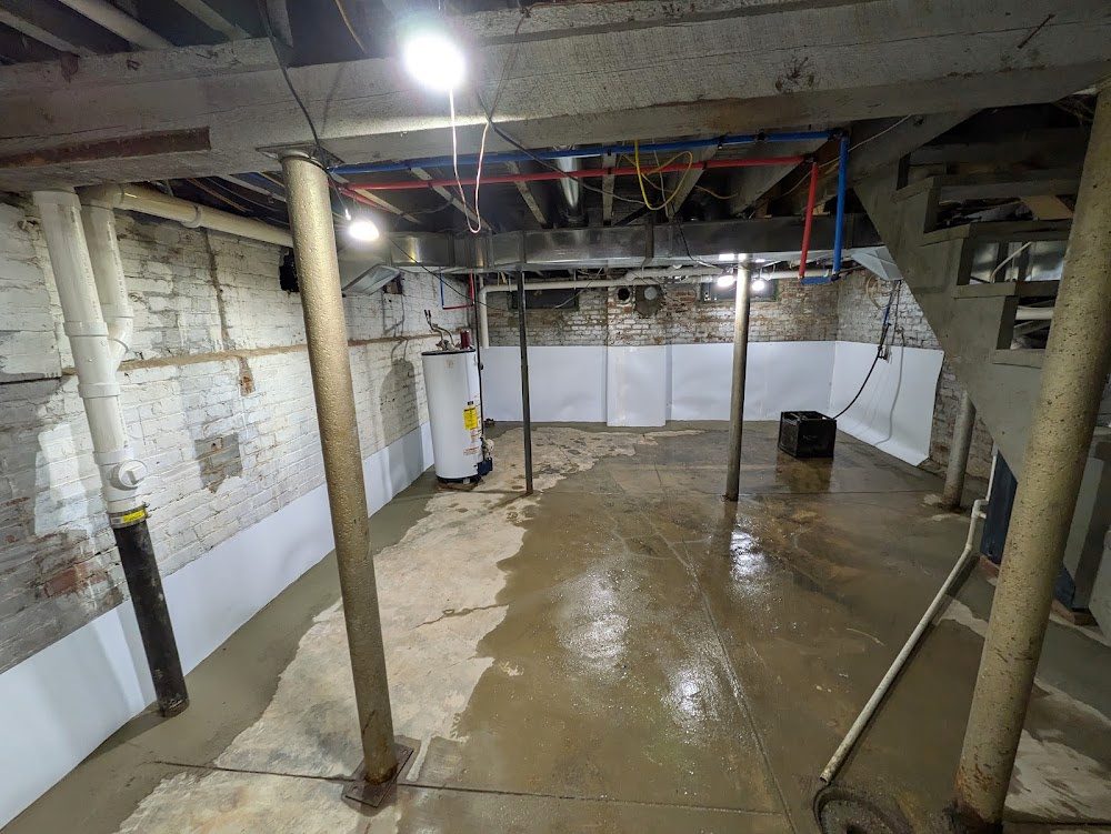 Broad lined basement with old masonry above