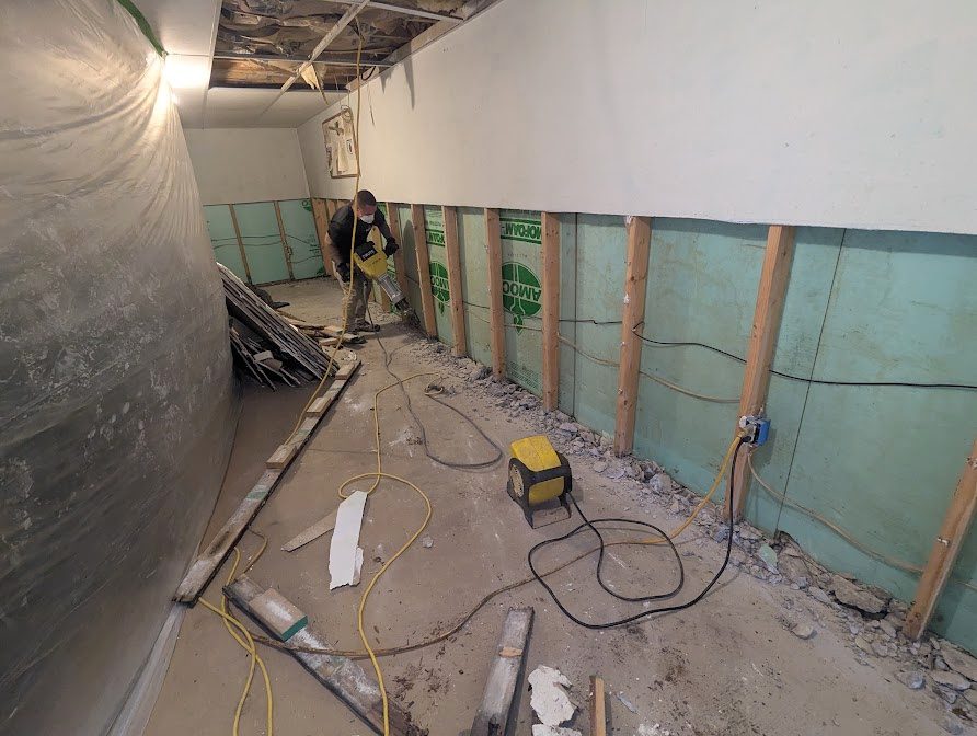 Long opened wall with worker at far end