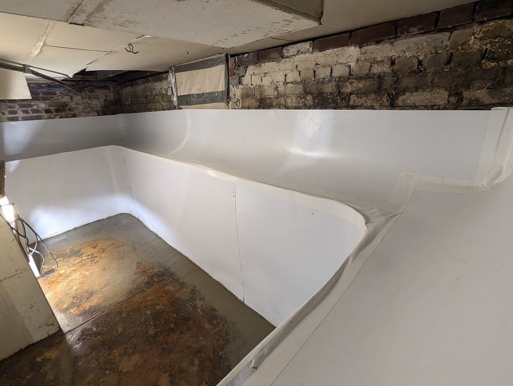 White-lined walls around a basement stair