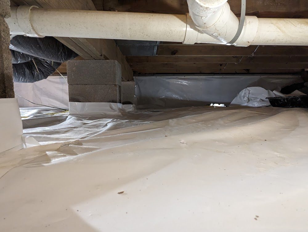 Liner beneath pipes and a pier