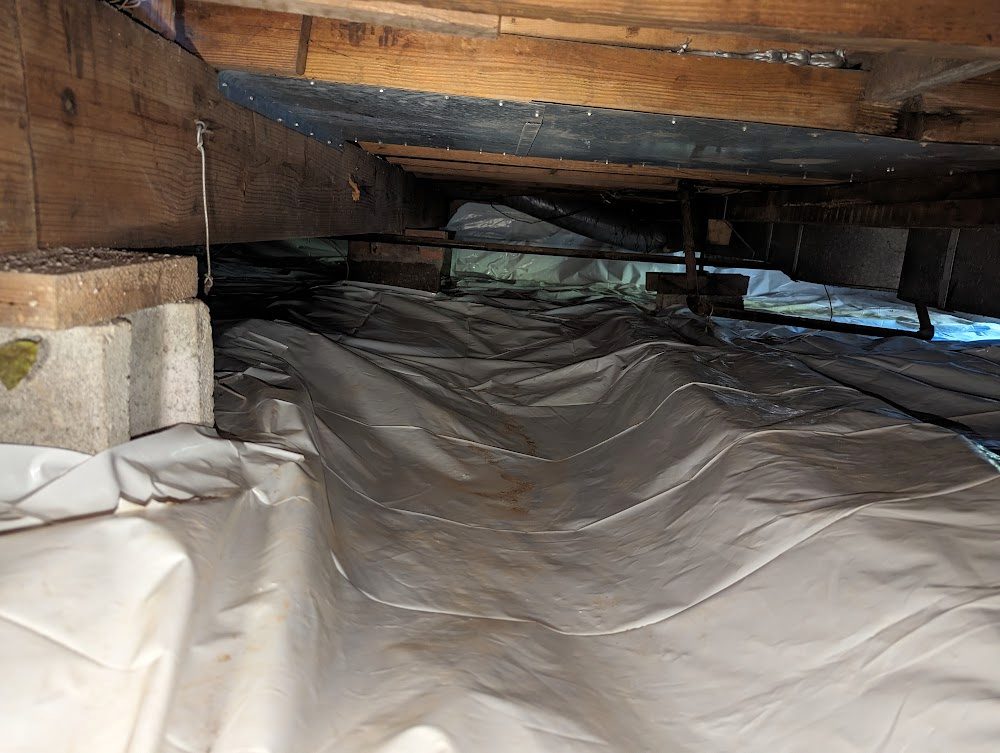 White liner across a low crawl space