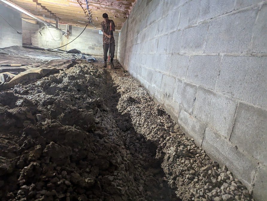 Long wall-edge trench with worker in distance