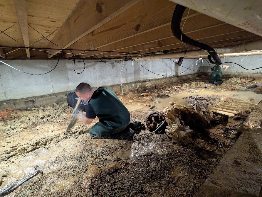 Crew digging in low crawl space
