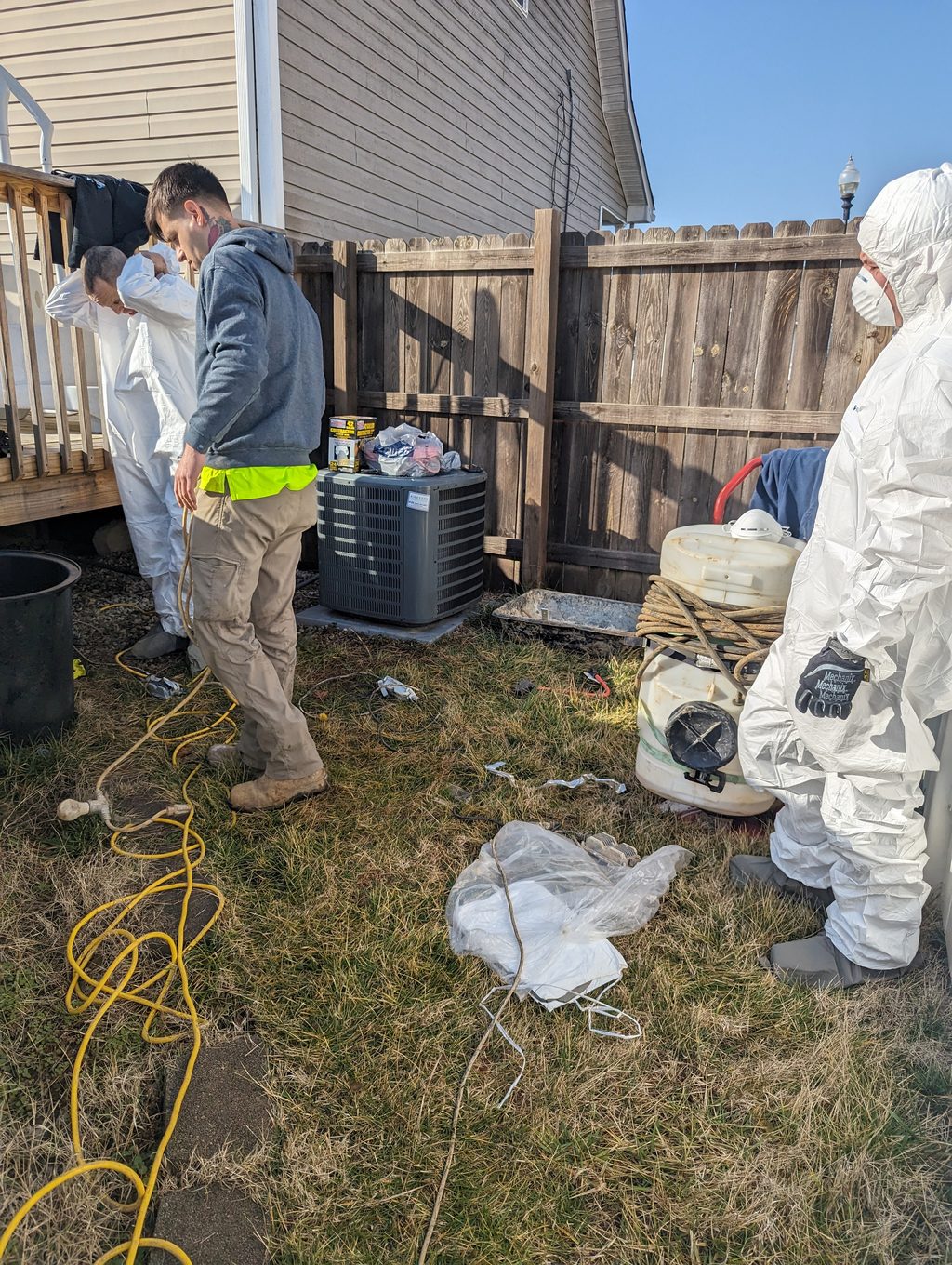 Watertight crew and equipment outside a Louisville home