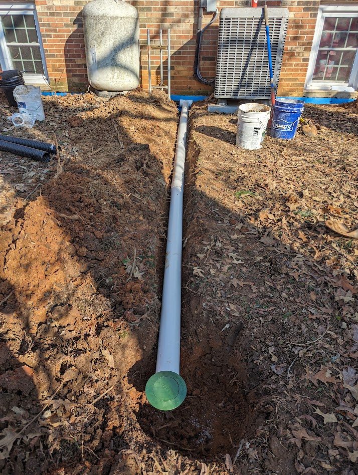 Drainage pipe leading toward green emitter