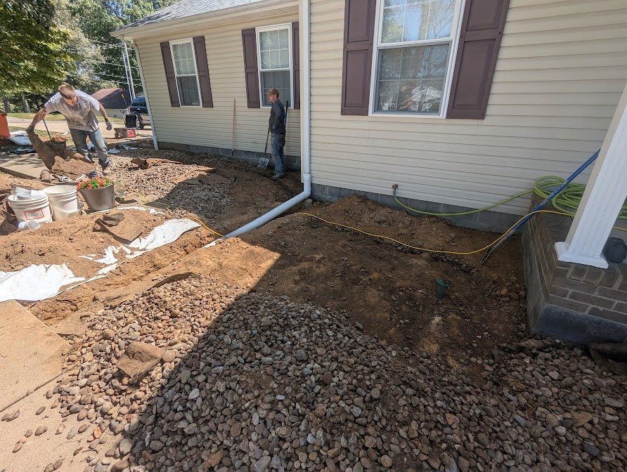 Downspout routing and gravel around home