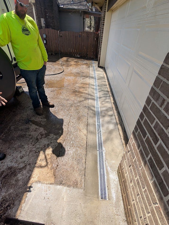 Long channel drain along finished pavement