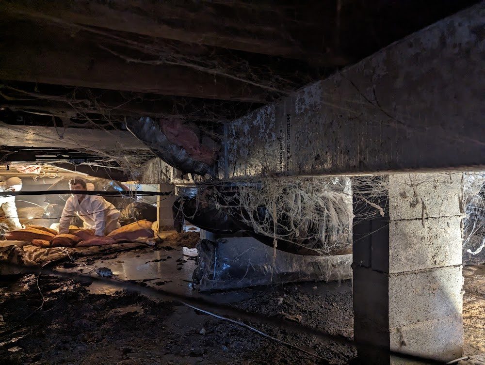 Dark timber beam over crawl space block support