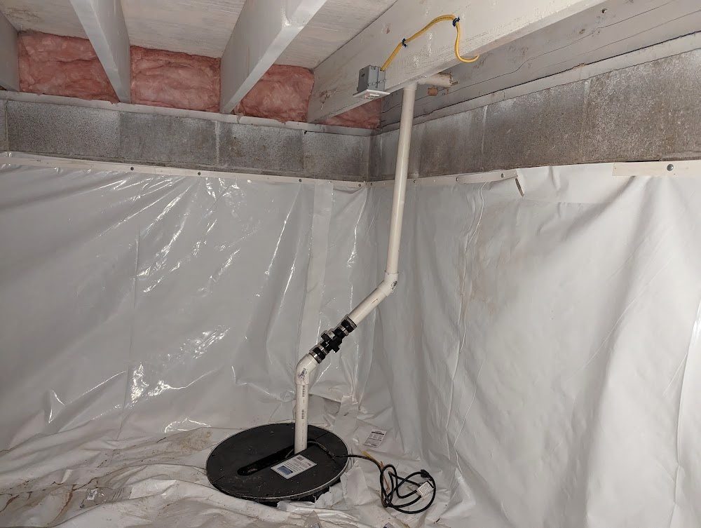 Sump basin, pipe and white crawl space liner