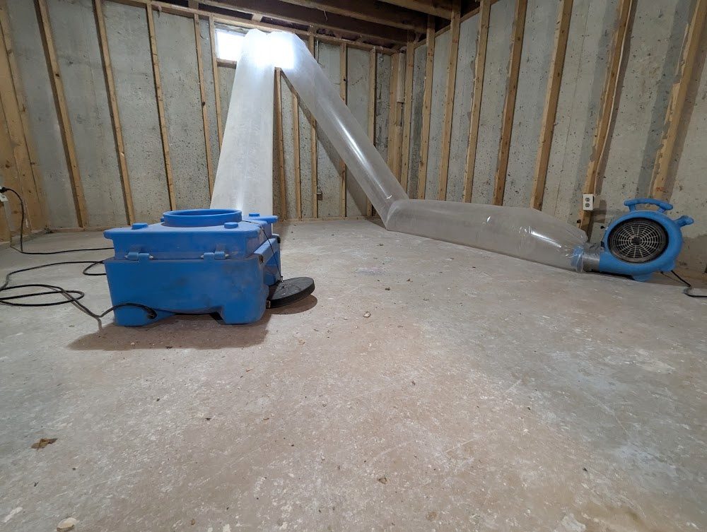 Blue drying equipment running in an unfinished room
